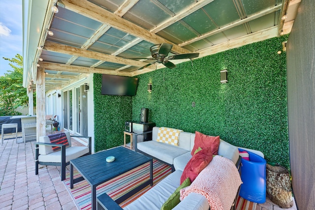 view of patio featuring ceiling fan and an outdoor living space