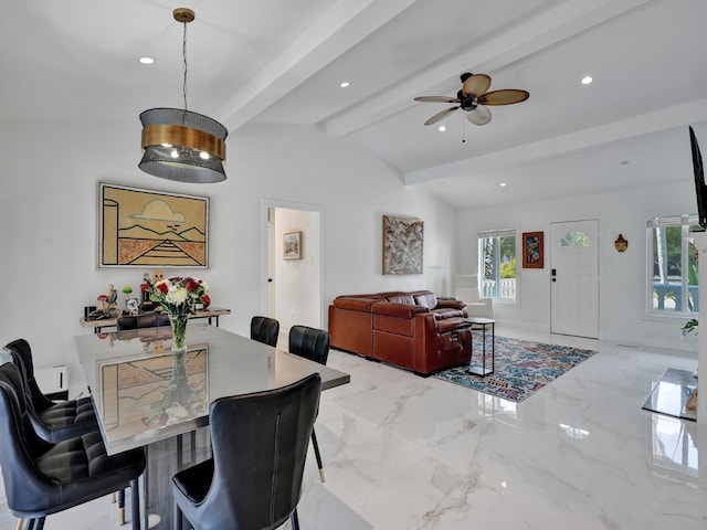 dining area with ceiling fan and lofted ceiling with beams