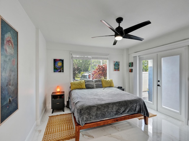 bedroom featuring ceiling fan, access to exterior, french doors, and multiple windows