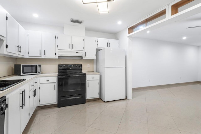 kitchen with sink, white cabinets, black appliances, and light tile patterned floors