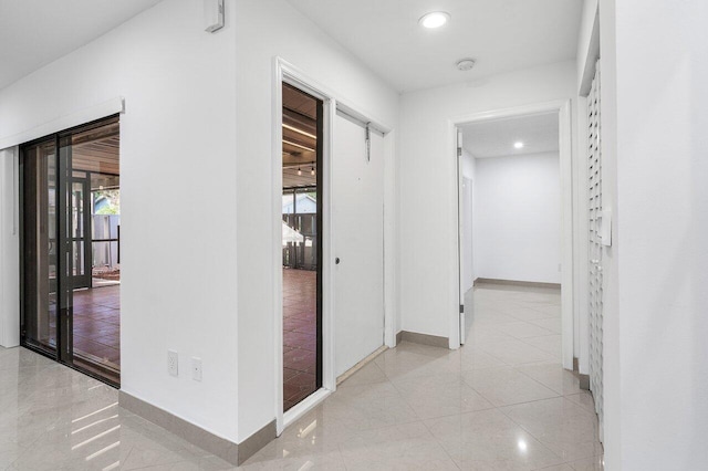 tiled empty room with a textured ceiling