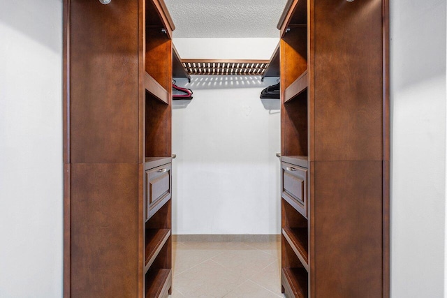 spare room with a textured ceiling and ceiling fan