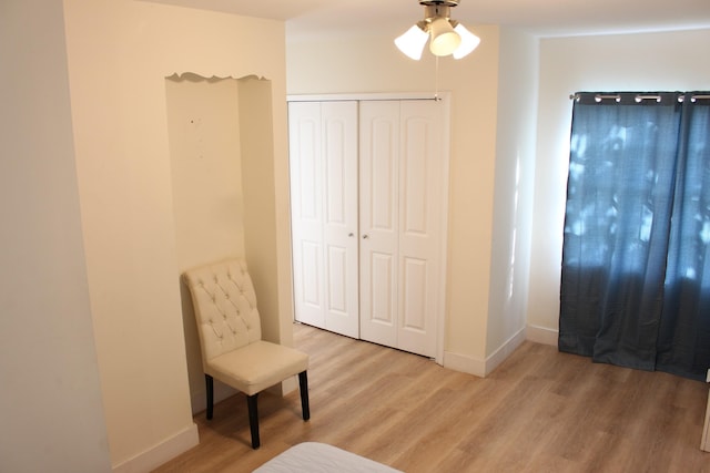 sitting room featuring light hardwood / wood-style floors