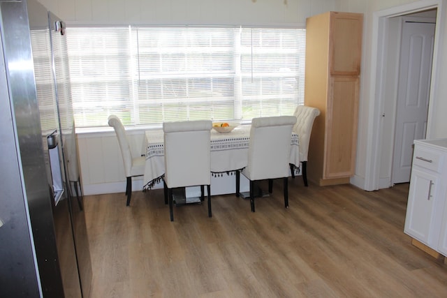 dining space featuring wood-type flooring