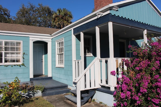 doorway to property with covered porch