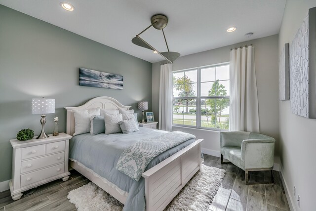 bedroom with hardwood / wood-style flooring