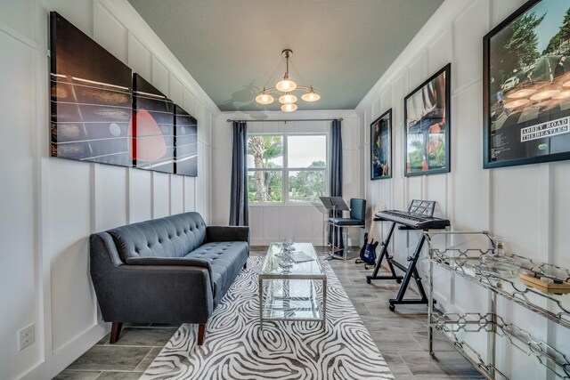 sitting room featuring a chandelier