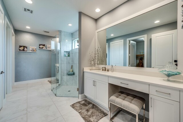 bathroom featuring vanity and a shower with door