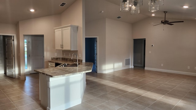 206 Riomar Dr, Port Saint Lucie, FL 34952 - kitchen with light tile patterned flooring, visible vents, high vaulted ceiling, and a sink