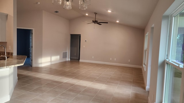 206 Riomar Dr, Port Saint Lucie, FL 34952 - unfurnished living room with visible vents, light tile patterned floors, a sink, and ceiling fan with notable chandelier