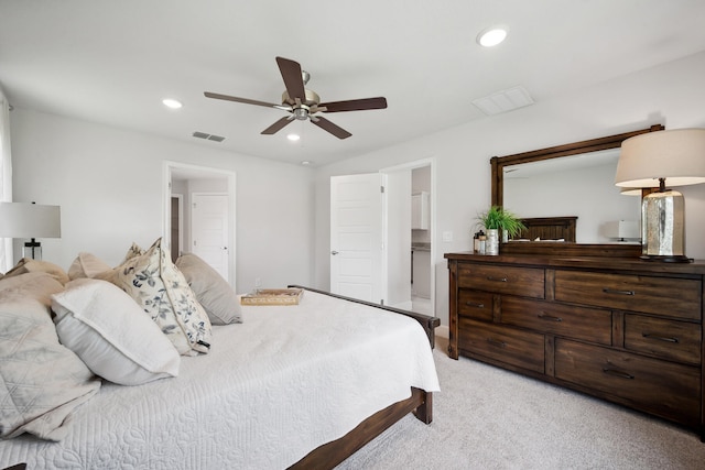 bedroom with ceiling fan and light carpet