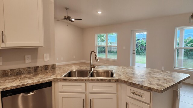 206 Riomar Dr, Port Saint Lucie, FL 34952 - kitchen with a peninsula, dishwasher, plenty of natural light, and a sink