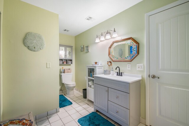 bathroom featuring vanity, tile patterned floors, and curtained shower