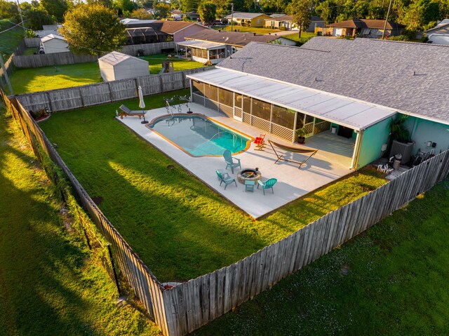 view of pool with a yard and a patio