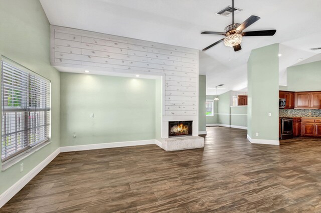 living room with french doors, vaulted ceiling, ceiling fan, and hardwood / wood-style floors