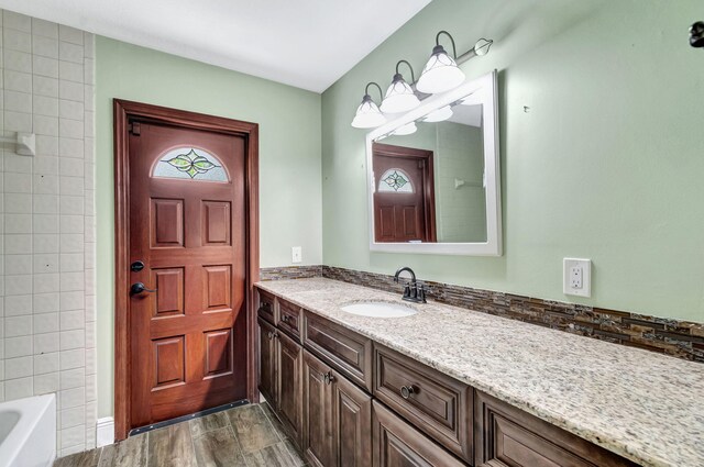 bathroom with vanity and wood-type flooring