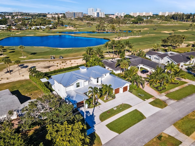 drone / aerial view featuring a water view and golf course view