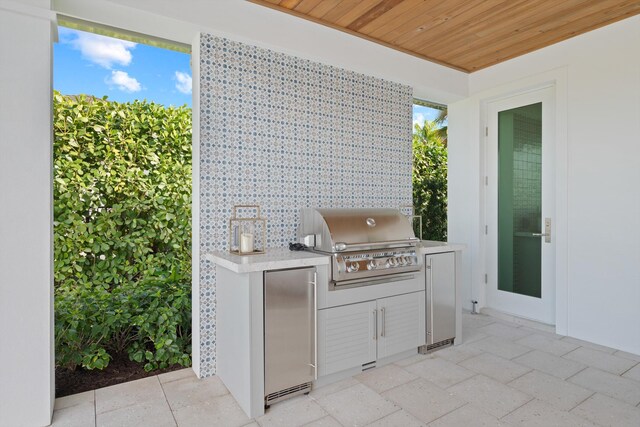 kitchen with white cabinetry, double oven range, sink, and pendant lighting