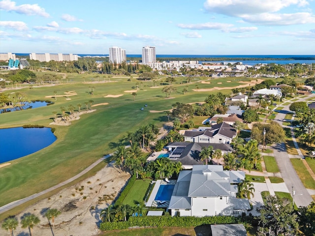 bird's eye view featuring a water view and golf course view