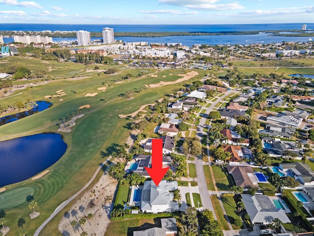 birds eye view of property with a water view