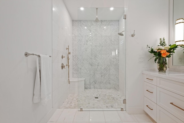 bathroom featuring vanity, tile patterned floors, and a shower with door