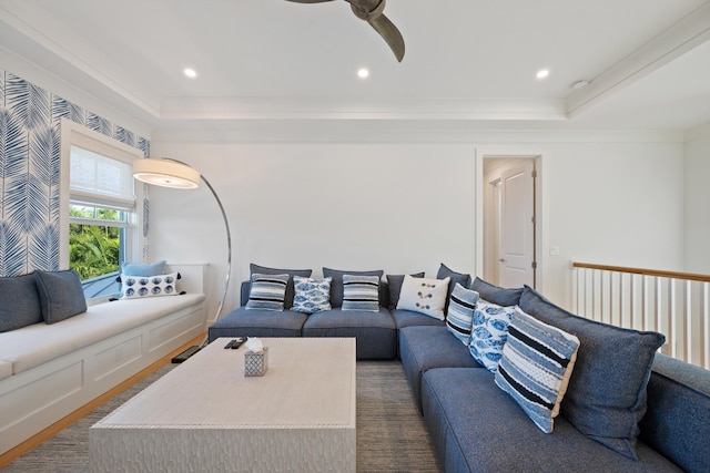 living room with crown molding, ceiling fan, a raised ceiling, and hardwood / wood-style floors