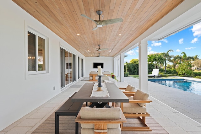 view of patio featuring ceiling fan