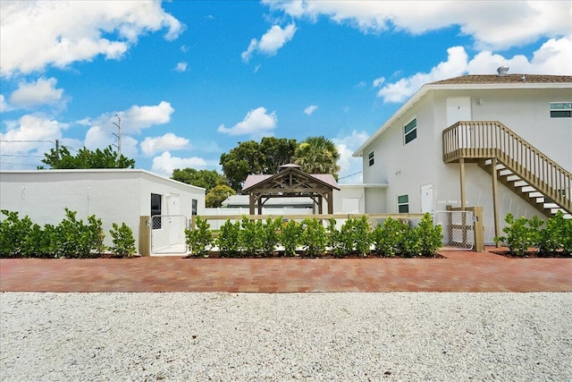 view of side of property with a gazebo