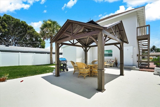 view of patio / terrace featuring a gazebo and a grill