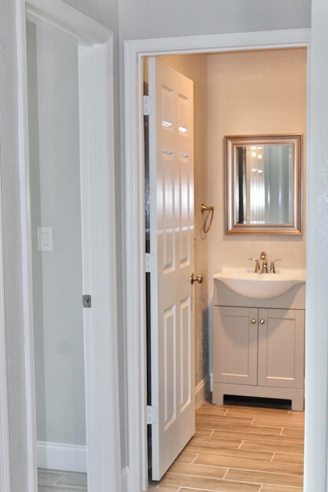 bathroom featuring vanity and wood-type flooring