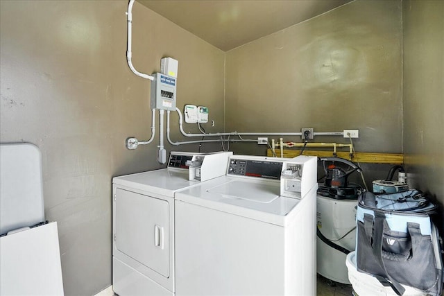 clothes washing area with washing machine and dryer