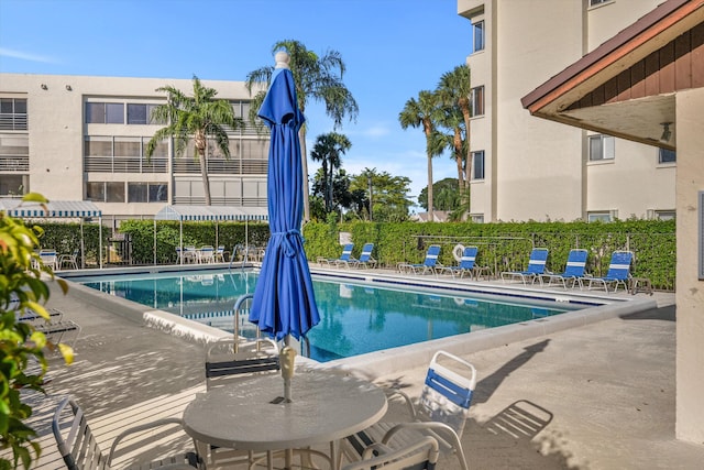 view of swimming pool featuring a patio area