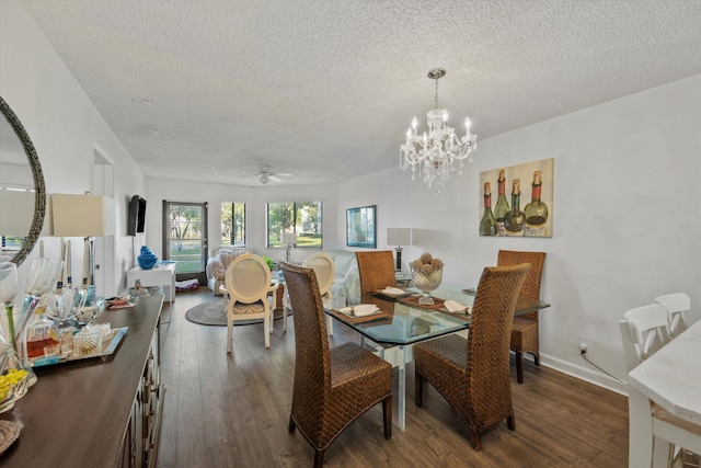 dining room with a textured ceiling, ceiling fan with notable chandelier, and dark hardwood / wood-style floors