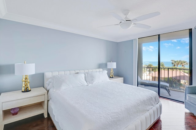 bedroom with floor to ceiling windows, access to outside, crown molding, ceiling fan, and wood-type flooring