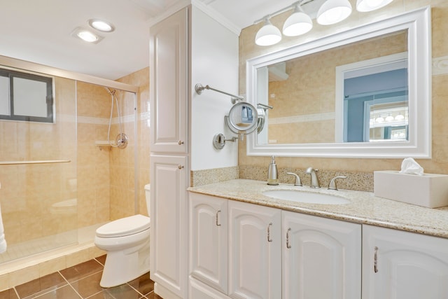 bathroom with walk in shower, tile patterned flooring, toilet, vanity, and ornamental molding