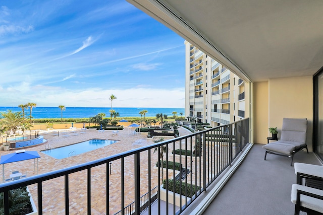 balcony featuring a water view