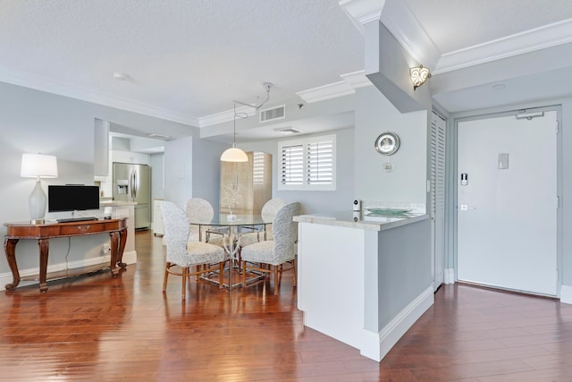 kitchen with kitchen peninsula, stainless steel fridge with ice dispenser, crown molding, and dark hardwood / wood-style floors