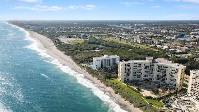 bird's eye view featuring a water view and a view of the beach