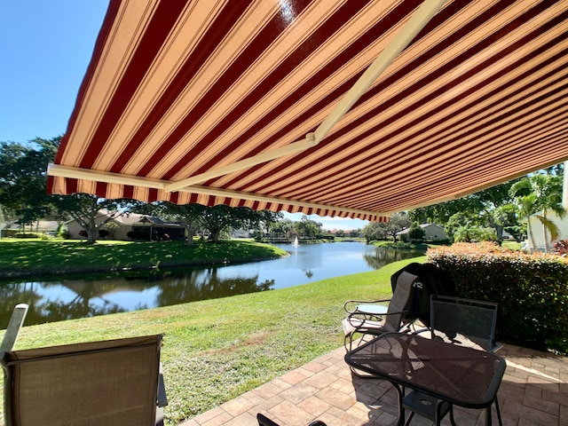 view of patio with a water view