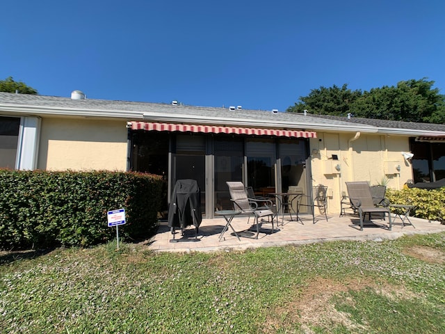 back of house featuring a patio