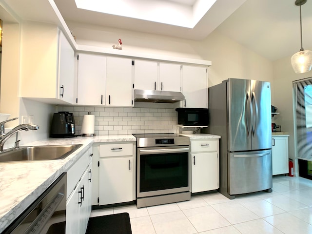 kitchen with sink, hanging light fixtures, vaulted ceiling, white cabinets, and appliances with stainless steel finishes