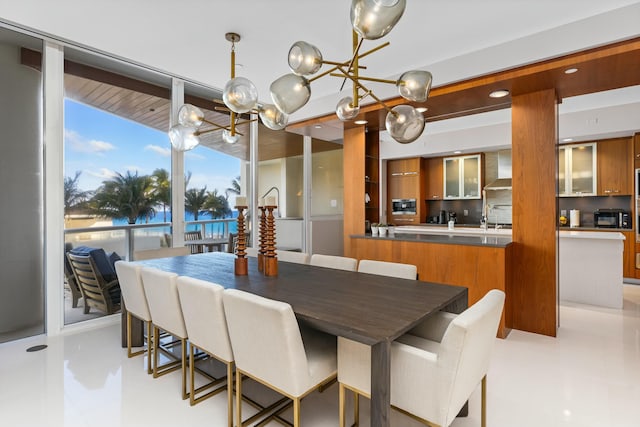 dining room featuring sink and a wall of windows