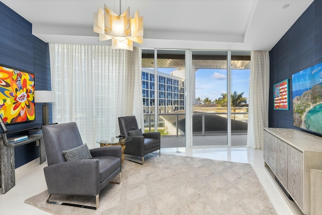 living area featuring expansive windows and light colored carpet