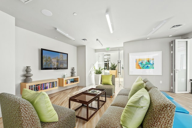 living room with light hardwood / wood-style floors