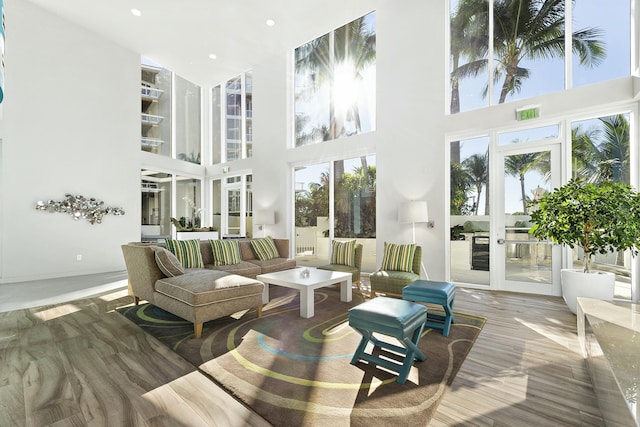 sunroom / solarium featuring a wealth of natural light and french doors