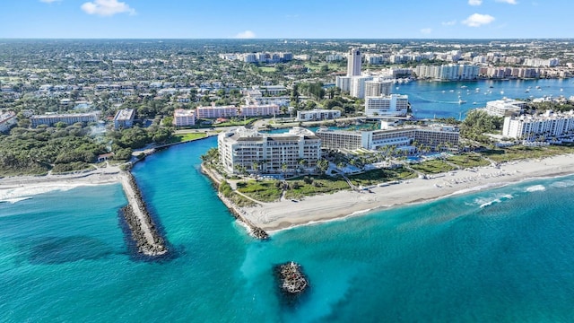 drone / aerial view with a water view and a beach view