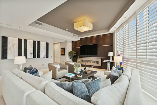 living room with a raised ceiling