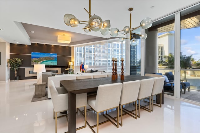 dining room featuring expansive windows and light tile patterned floors