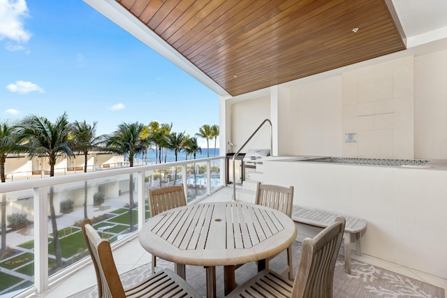 balcony featuring a water view