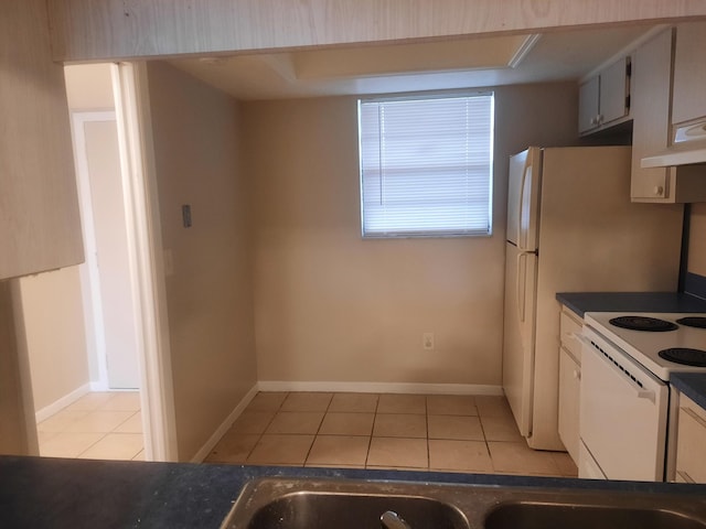 kitchen featuring white range with electric cooktop and light tile patterned floors